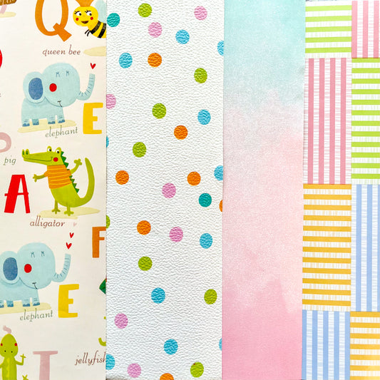Assortment of baby gift wrap including light and pastel colors, the alphabet, animals, stripes, and polka dots