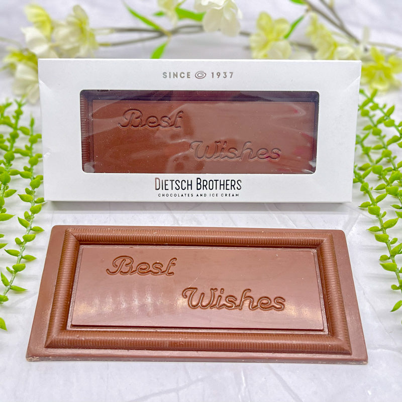 Milk chocolate bar that features "Best Wishes" across it, and a raised border along the edges