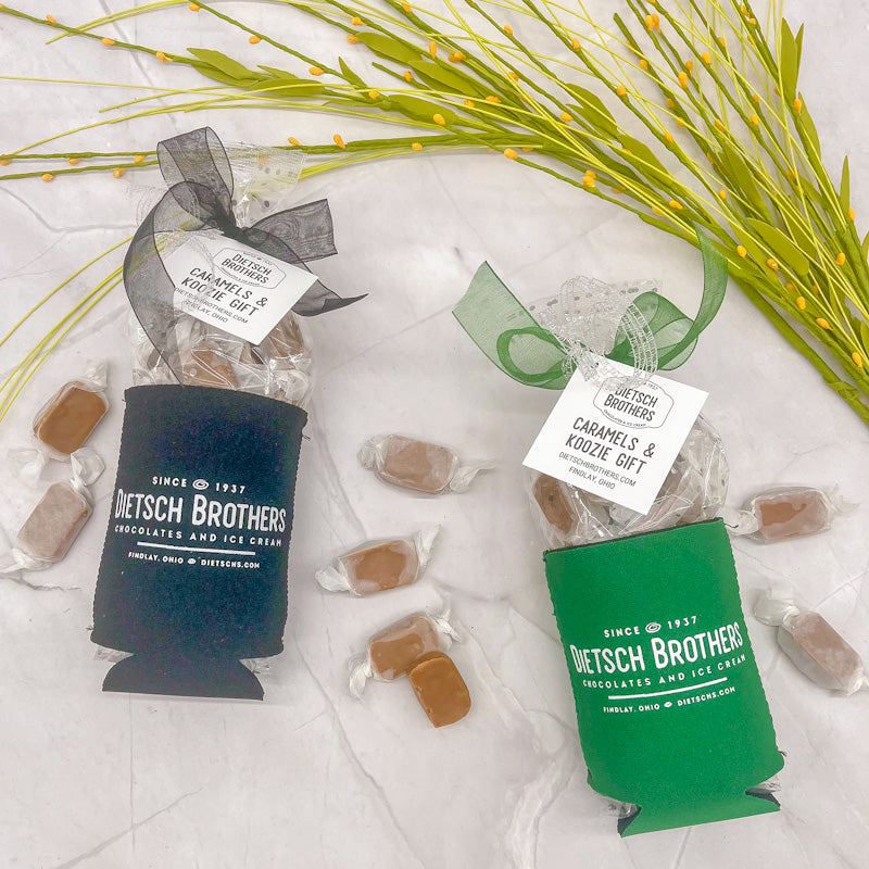 Dark blue and light green koozie with white Dietsch Brothers logo, filled with wrapped caramels
