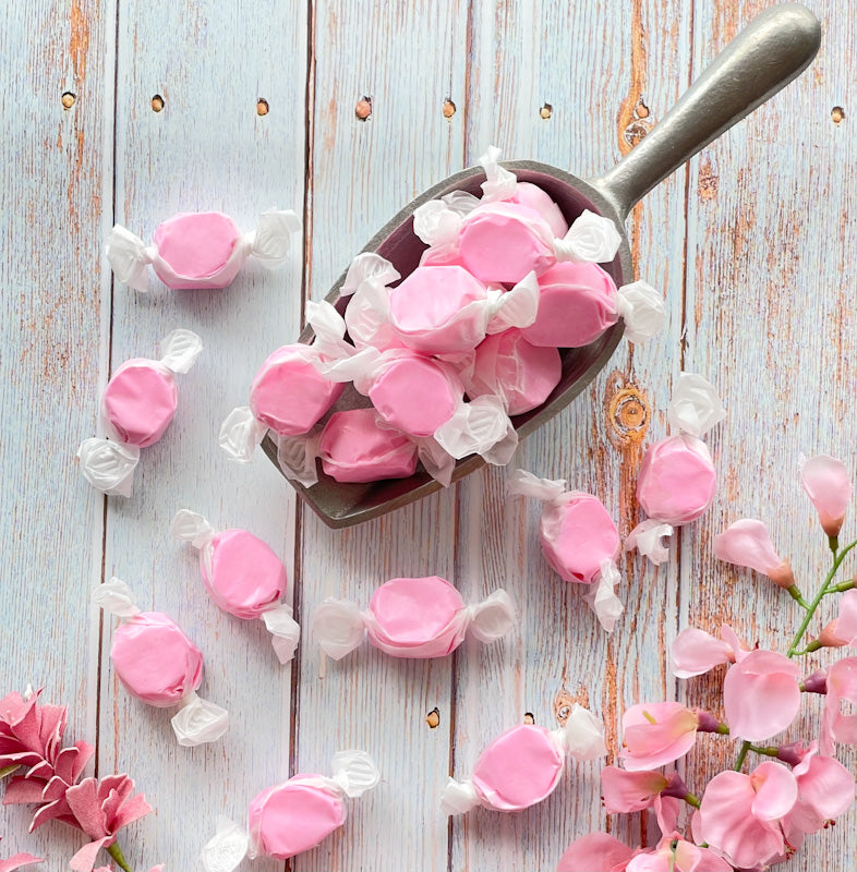 Strawberry taffy that features a solid light pink color.