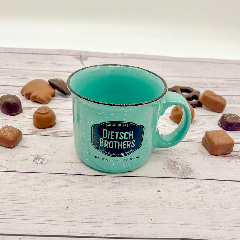 White spotted teal mug with black Dietsch Brothers logo