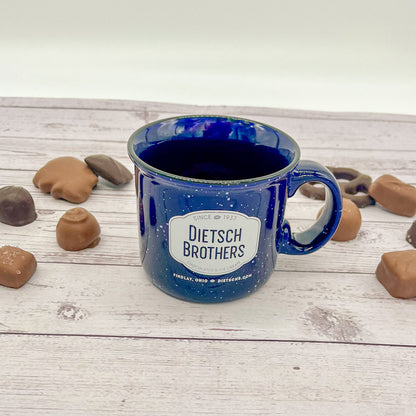 White spotted blue mug with white Dietsch Brothers logo