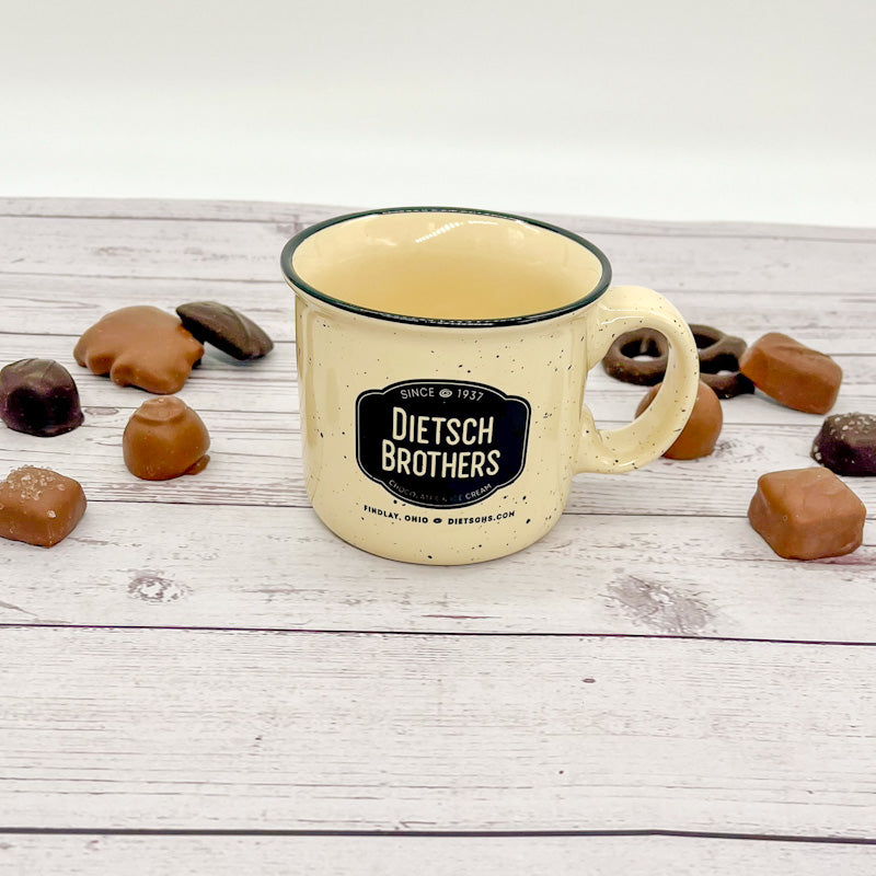 Black spotted cream mug with black Dietsch Brothers logo