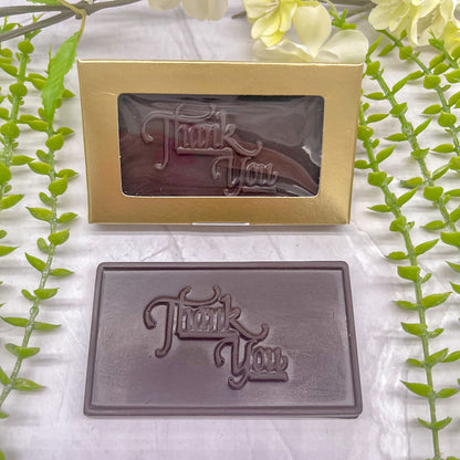 Dark chocolate bar that features a raised "Thank You" across it