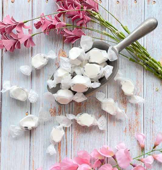 Licorice flavored taffy that features a white center with black and white stripes around the outer layer.