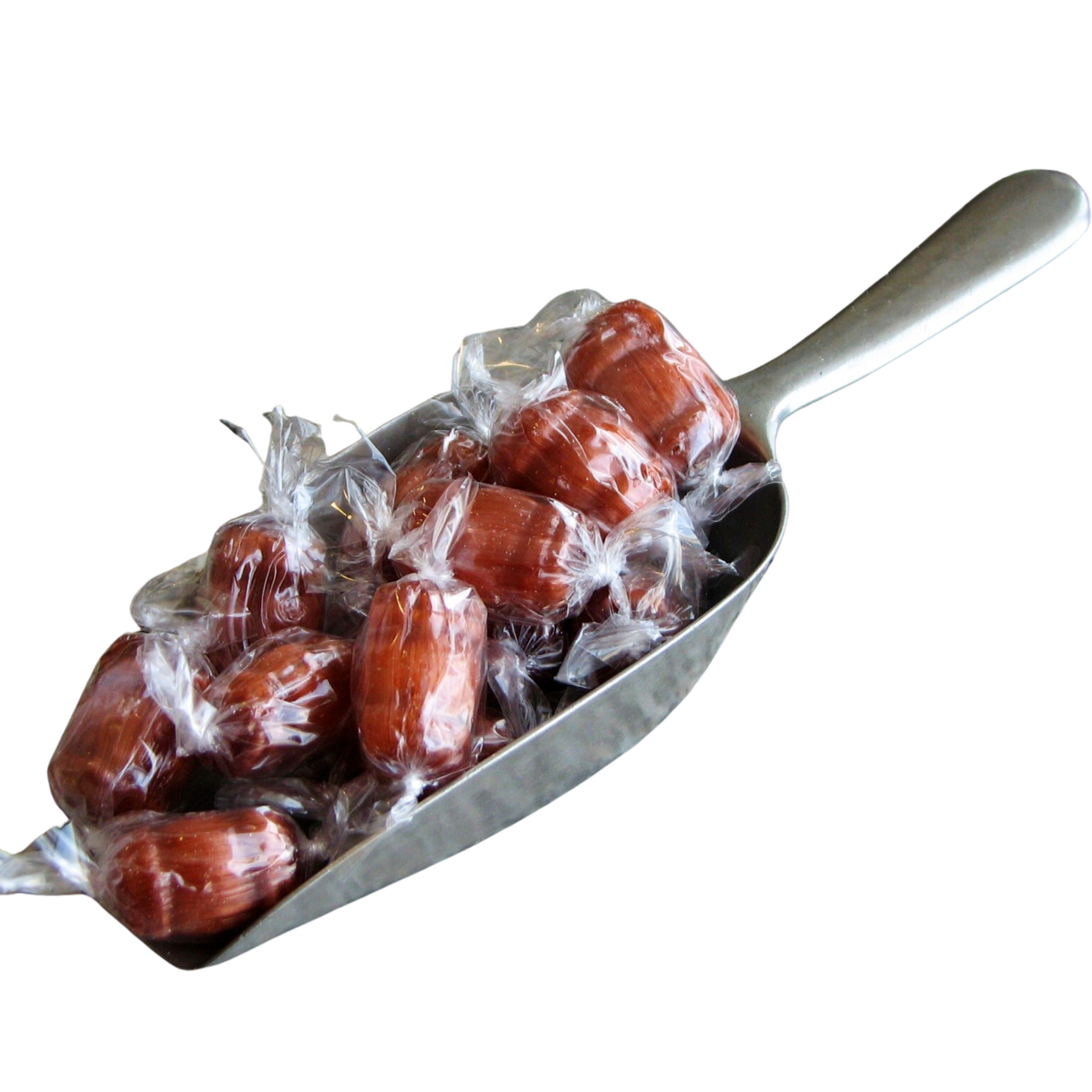 Scoop of individually wrapped light brown Root Beer Barrels