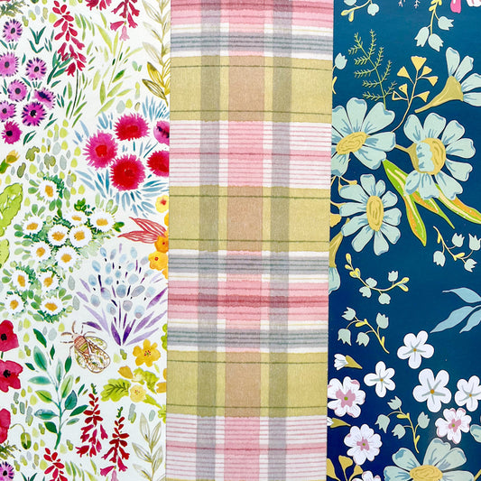Assortment of spring papers including multiple colors and floral designs