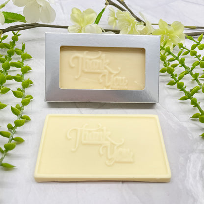 White chocolate bar that features a raised "Thank You" across it